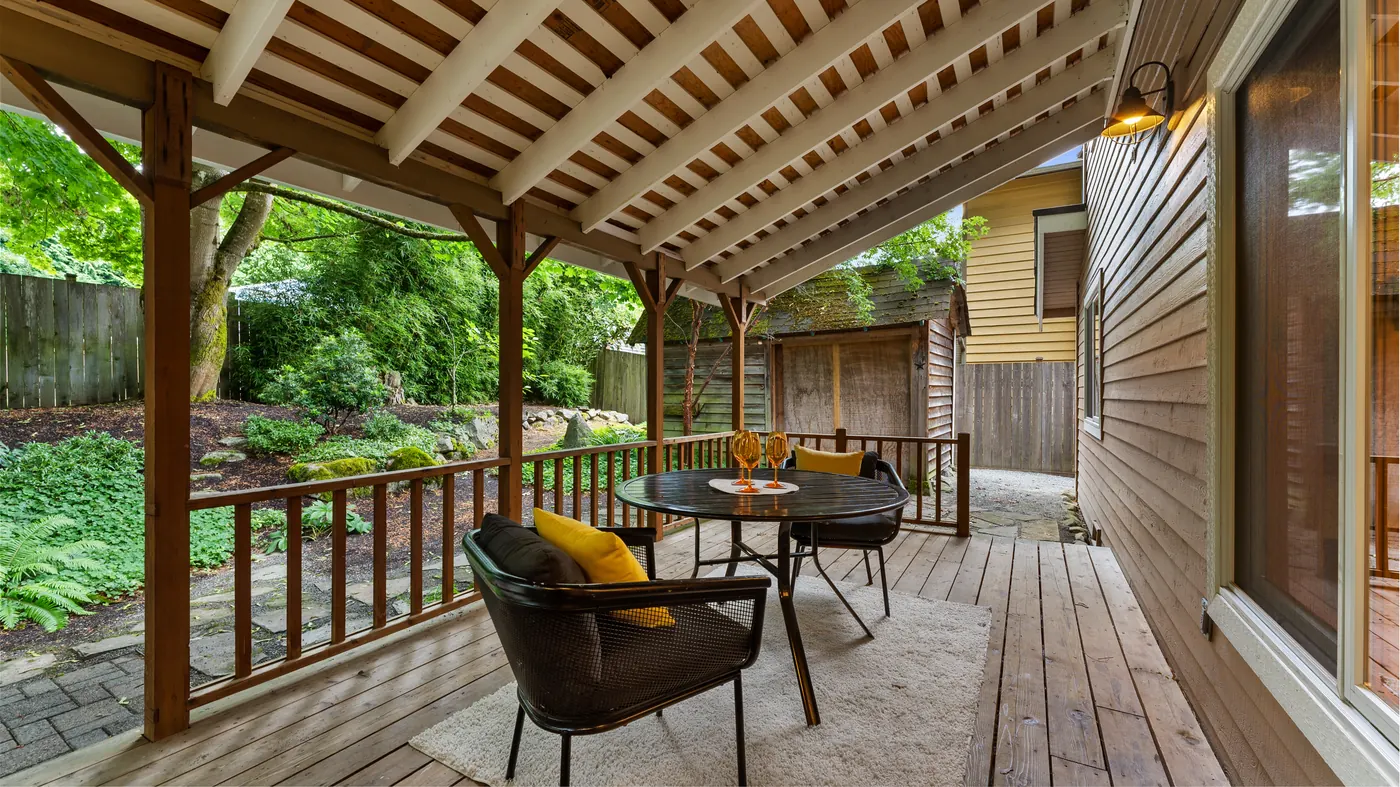 Covered back patio with outdoor furniture